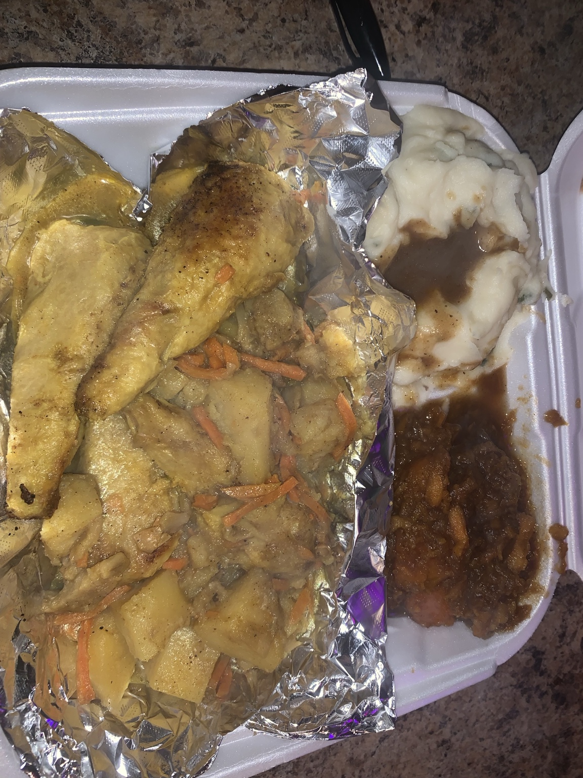 Vegan curry chicken meal with potatoes, carrots, mashed potatoes and baked beans