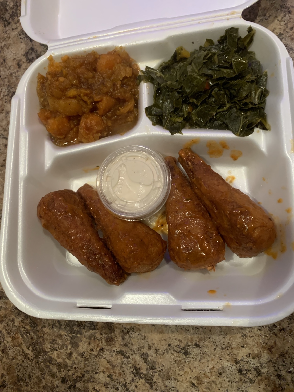 Four sauced vegan drumsticks with candied yams, collard greens and dipping sauce